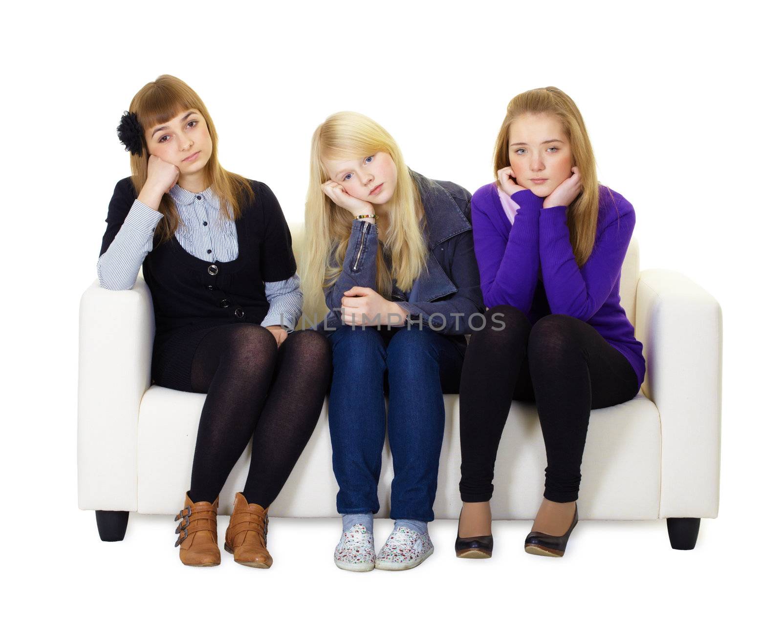 Three bored friends sitting on the couch. White isolated background