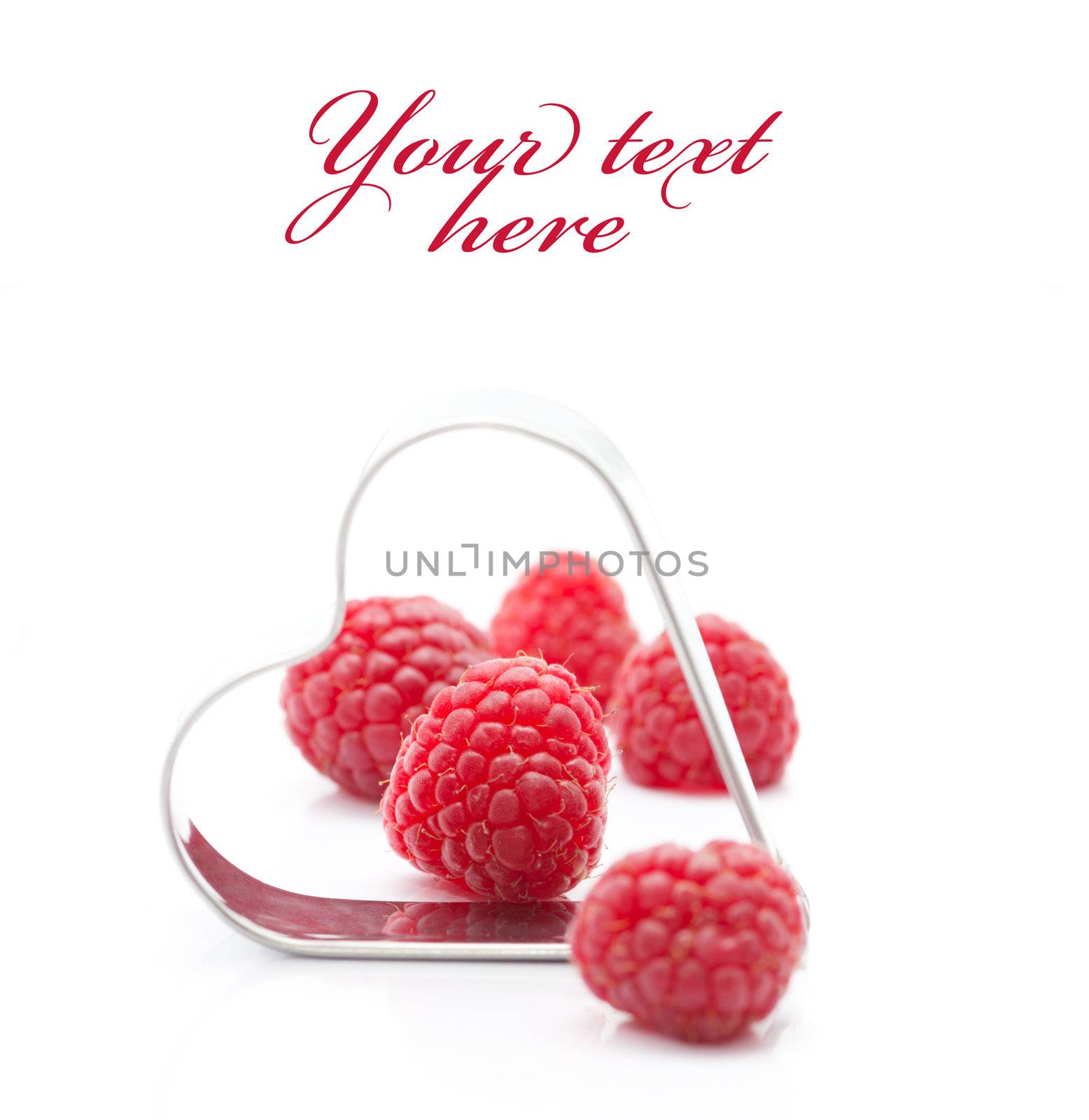 Fresh raspberries with metallic heart (easy removable text)