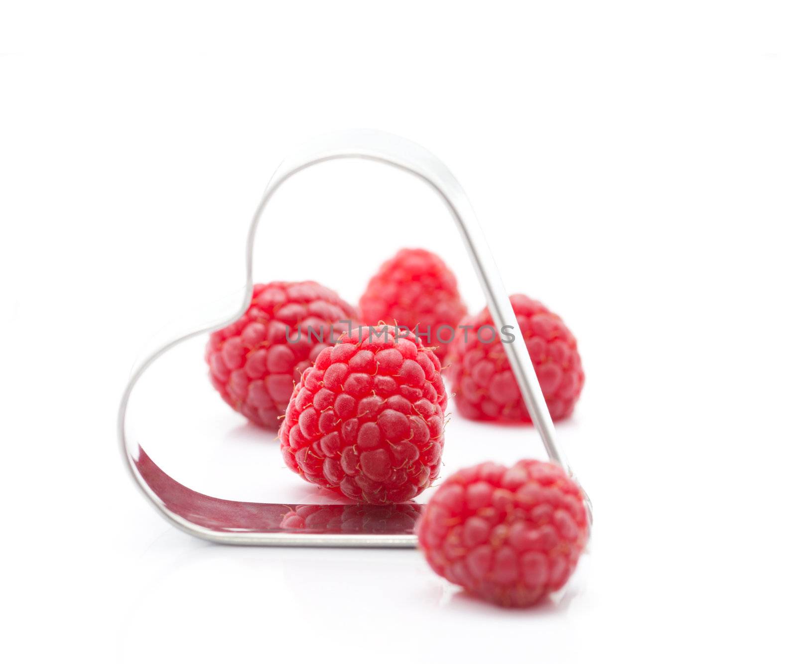 Fresh raspberries with metallic heart (easy removable text)