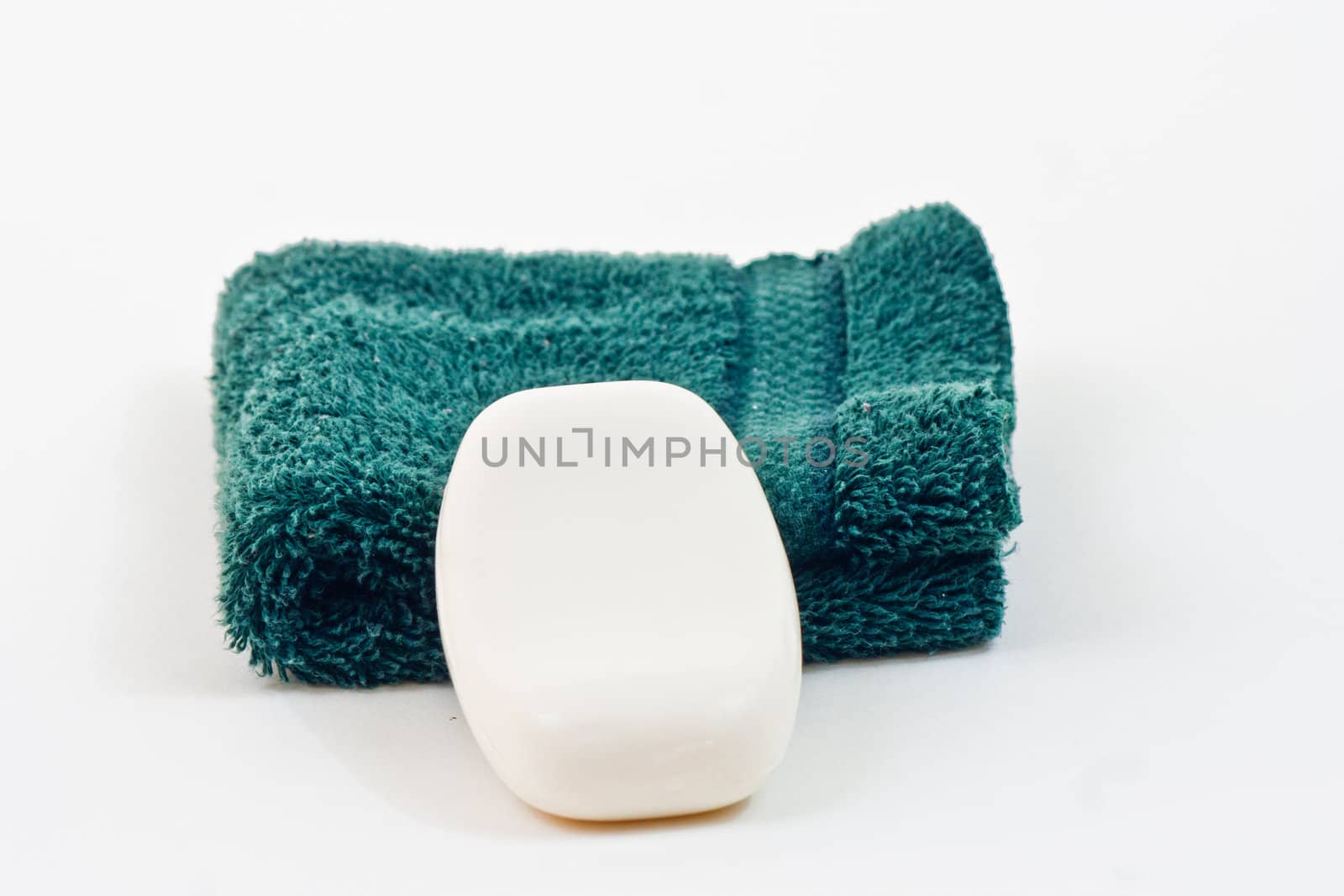 Bar of SoapBar of soap on a wash cloth, white background