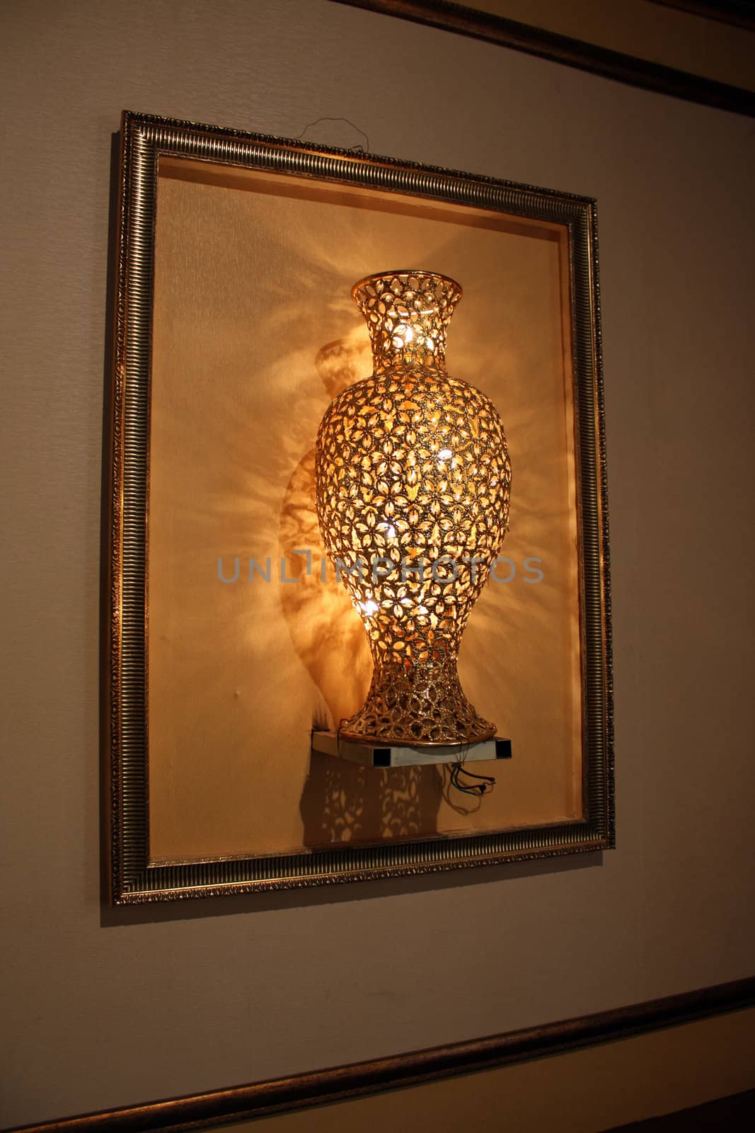 A beautiful lamp designed in the shape of a large flower vase.