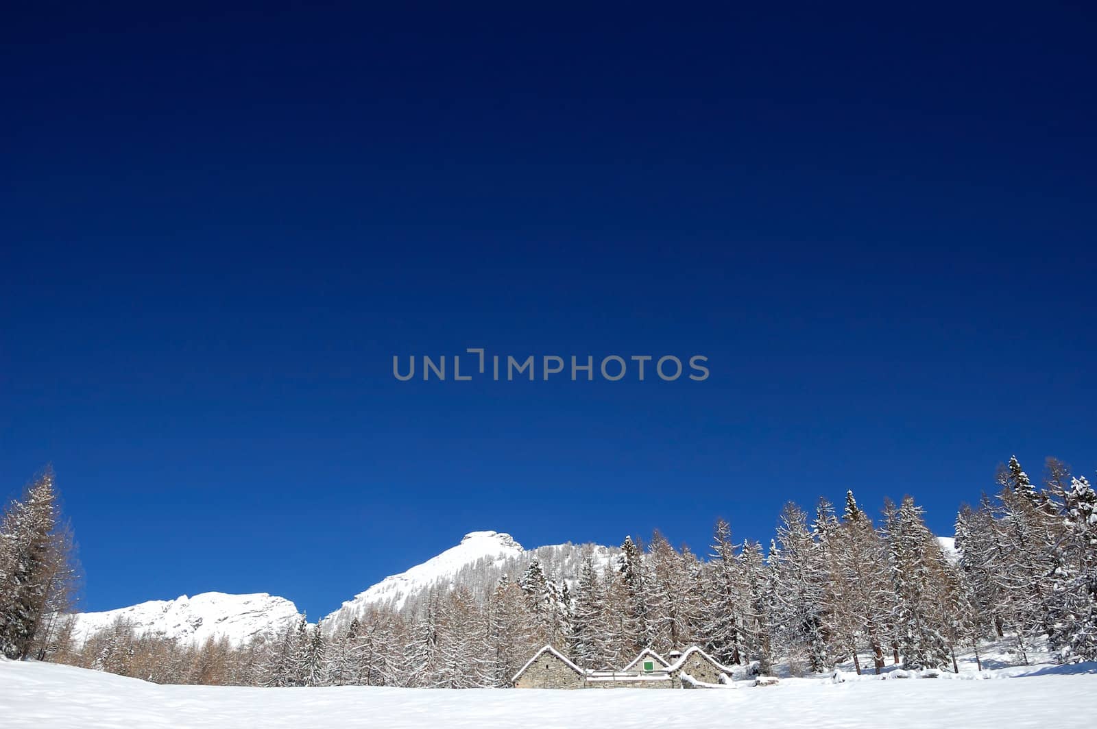 blue sky over snowy mountain by aletermi