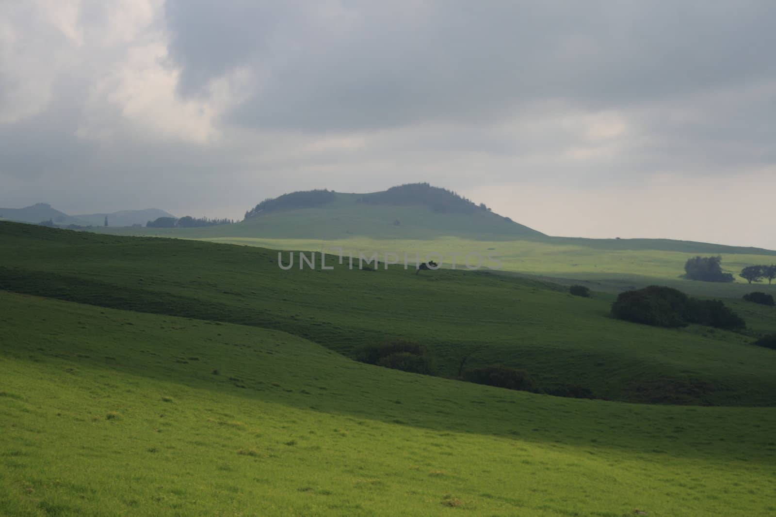 hillside with storm approaching by njene