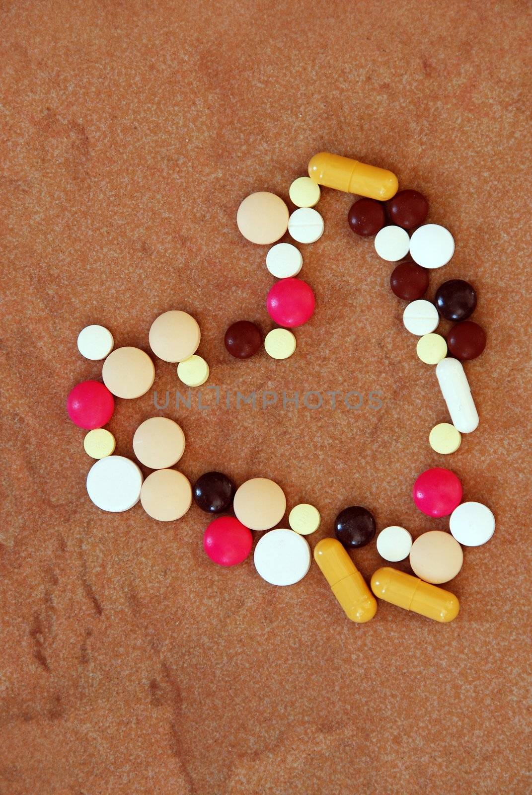 various colorful pills in heart shape