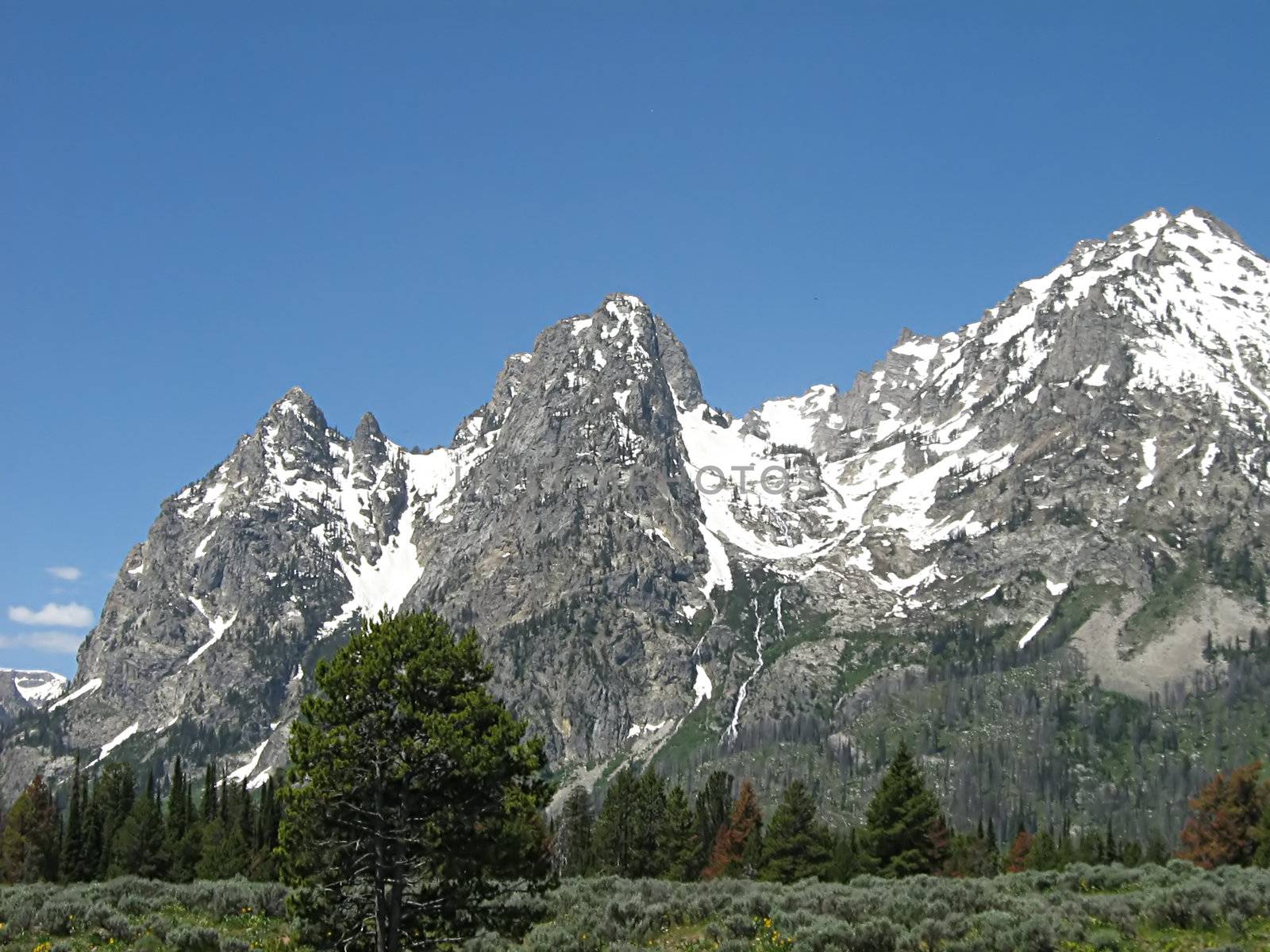 A photograph of a peaceful mountain landscape.