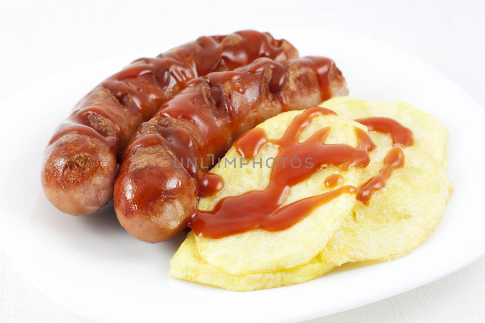 Fried sausages and potatoes by magraphics