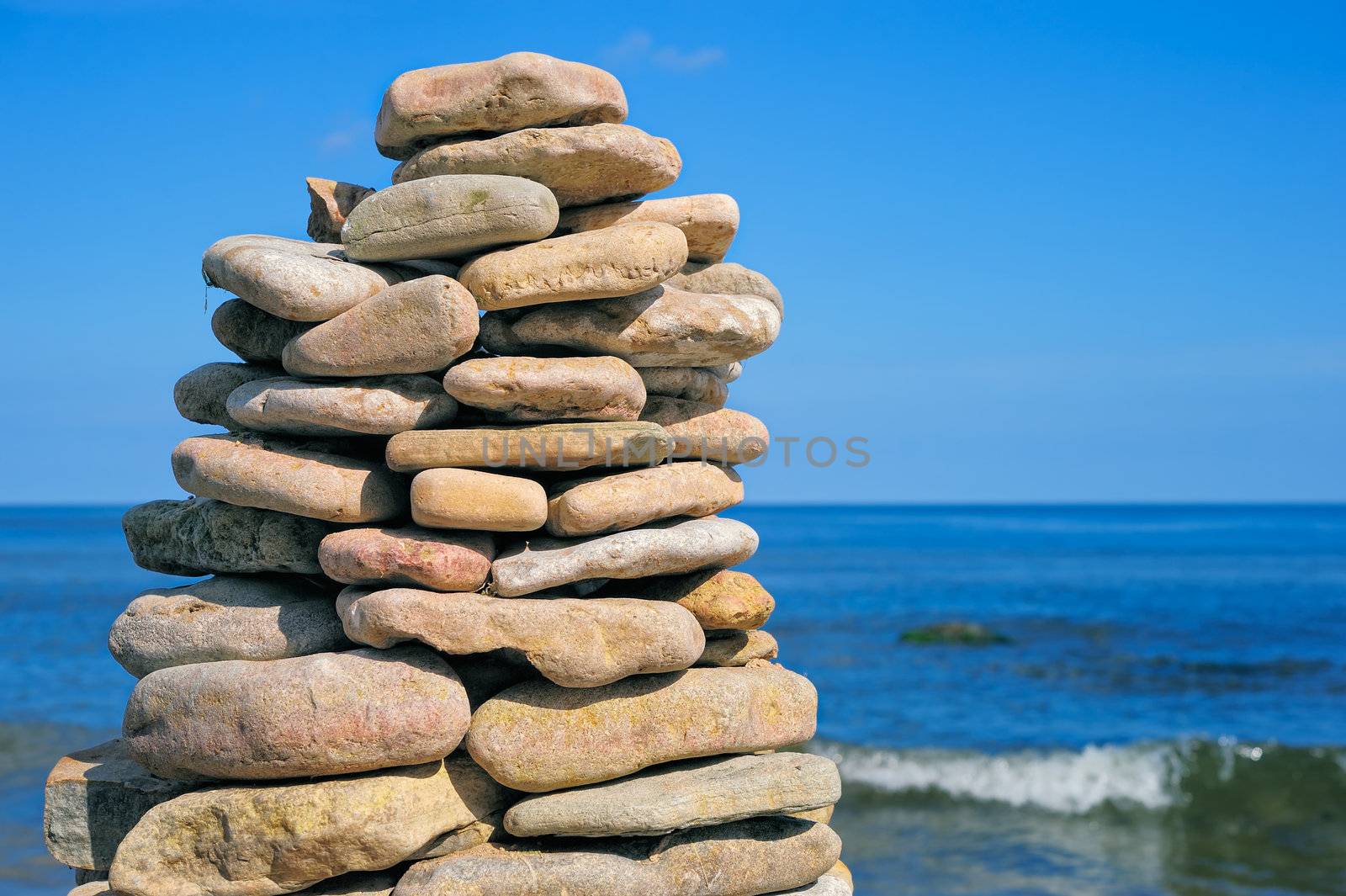 Stout pile of boulders on the sea shore