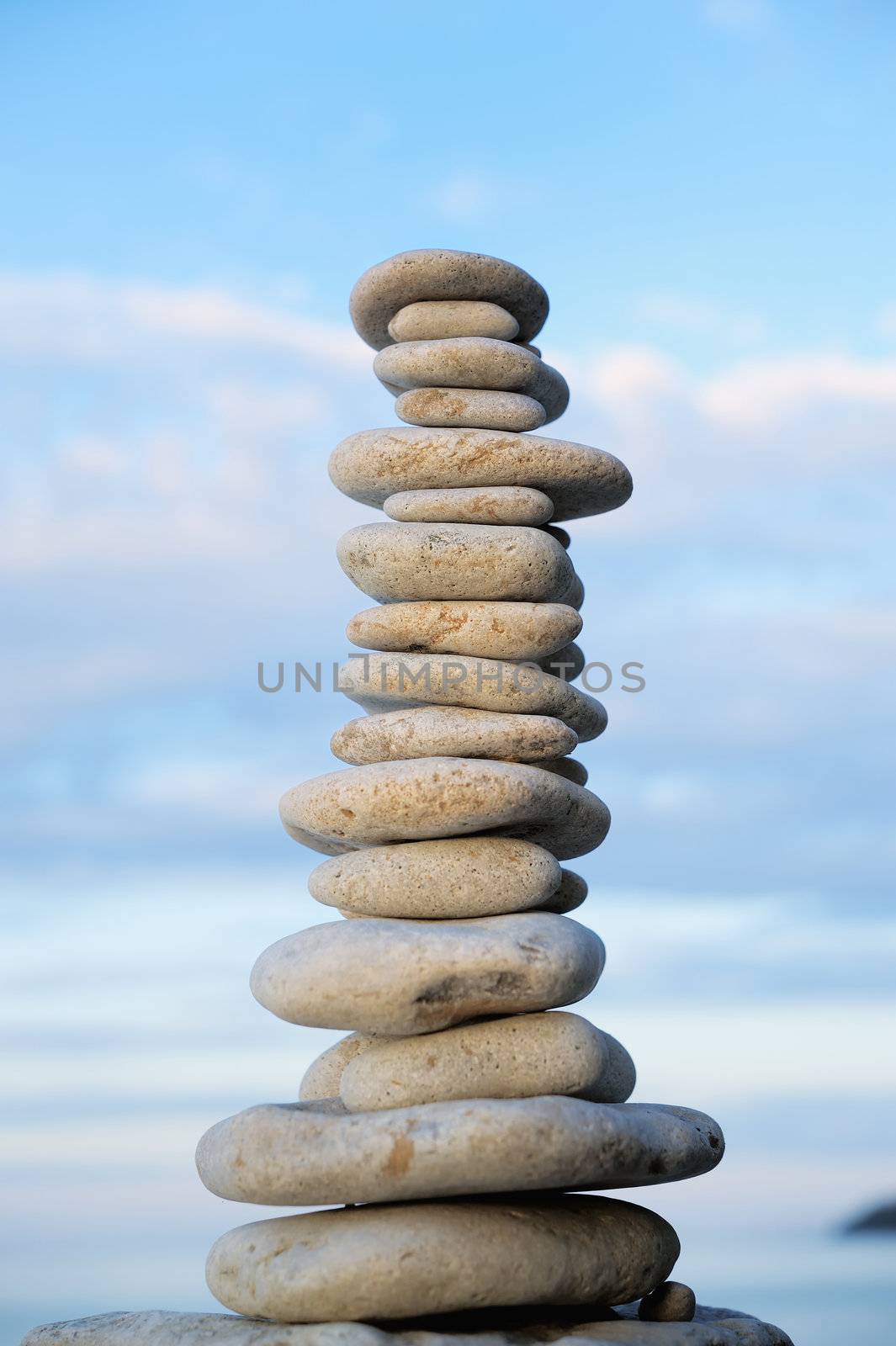White Stack of zen stones on a sky background