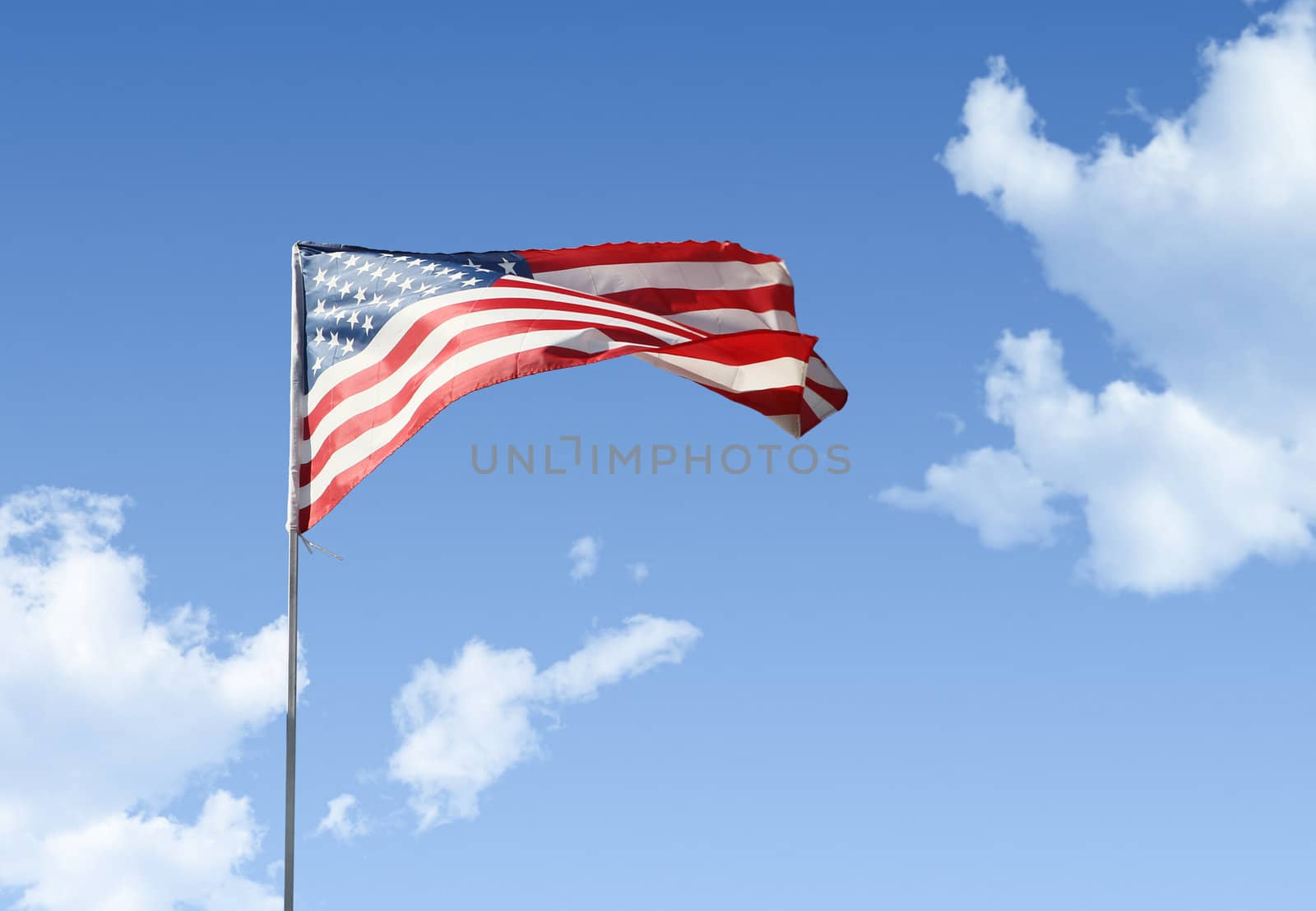 American flag against blue sky