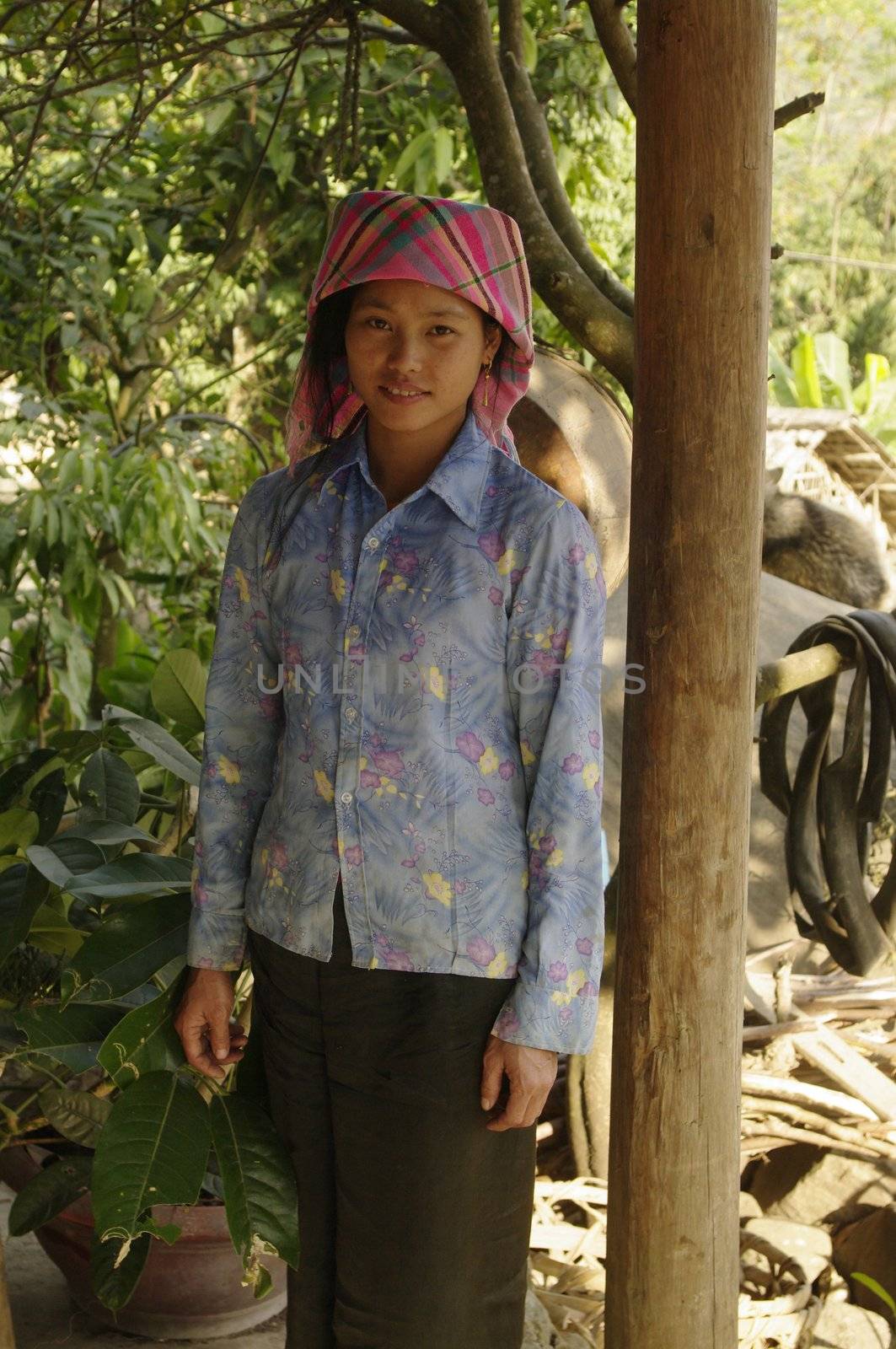 Girl Thai ethnicity, the largest minority in North Vietnam. The Thai merchants are. They live in the valleys in houses on stilts. Their dress is very modern