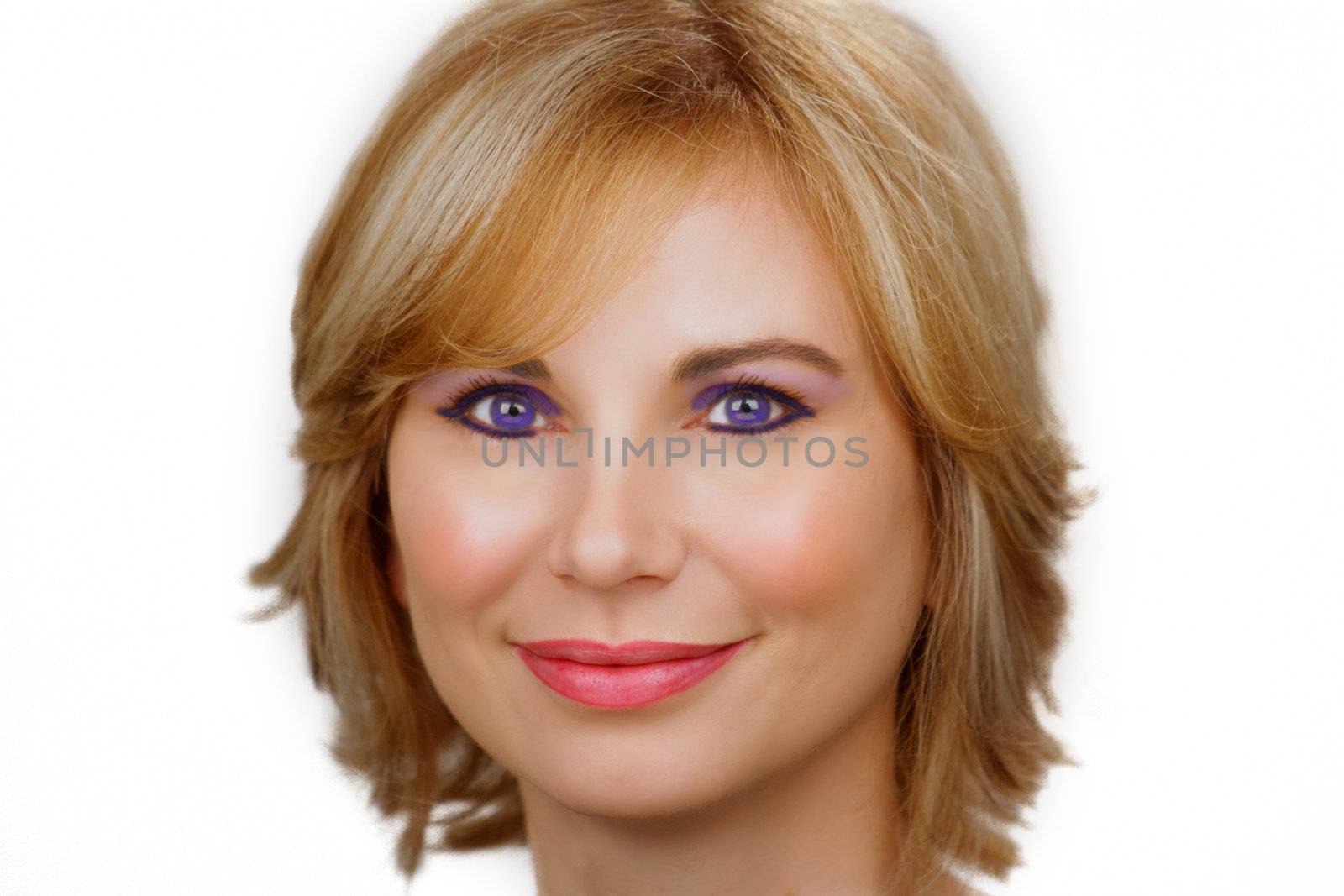 Close-up of a lovely young blue-eyed, woman with sandy-blonde hair, plain white background.