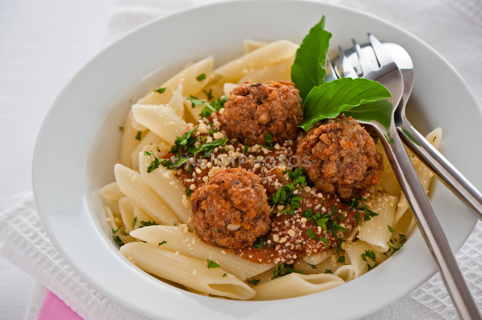 Pasta with tomato garlic sauce and meatballs