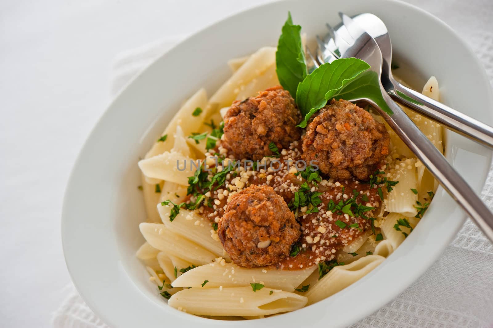 Pasta with tomato garlic sauce and meatballs