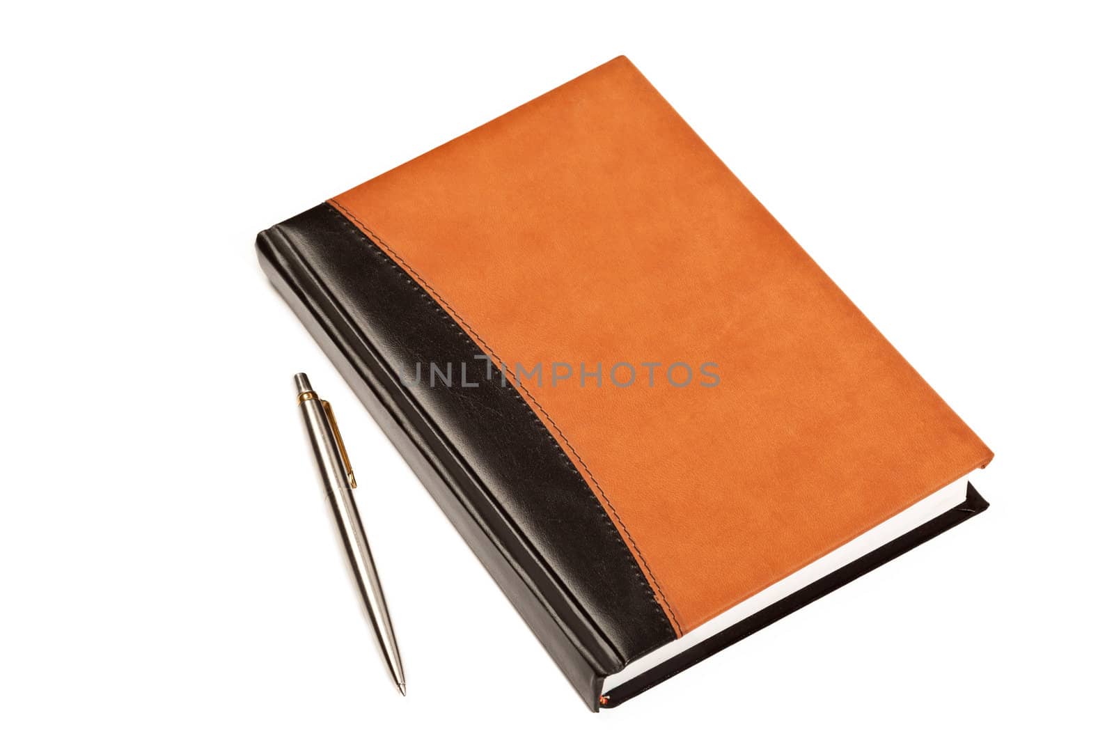 Diary with leather cover and metal pen on table isolated on white background