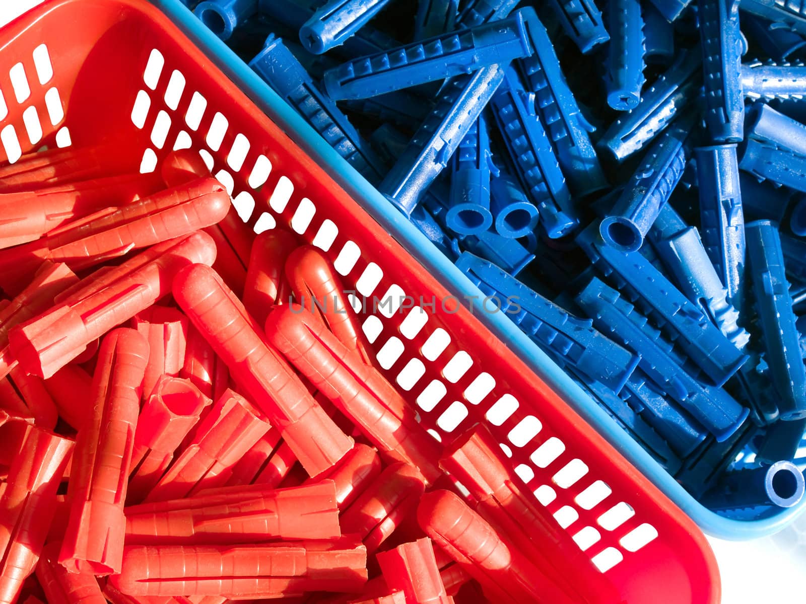 Blue and red plastic wall plugs