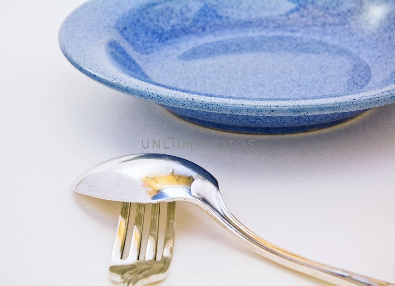 spoon on fork and blue plate by Qod