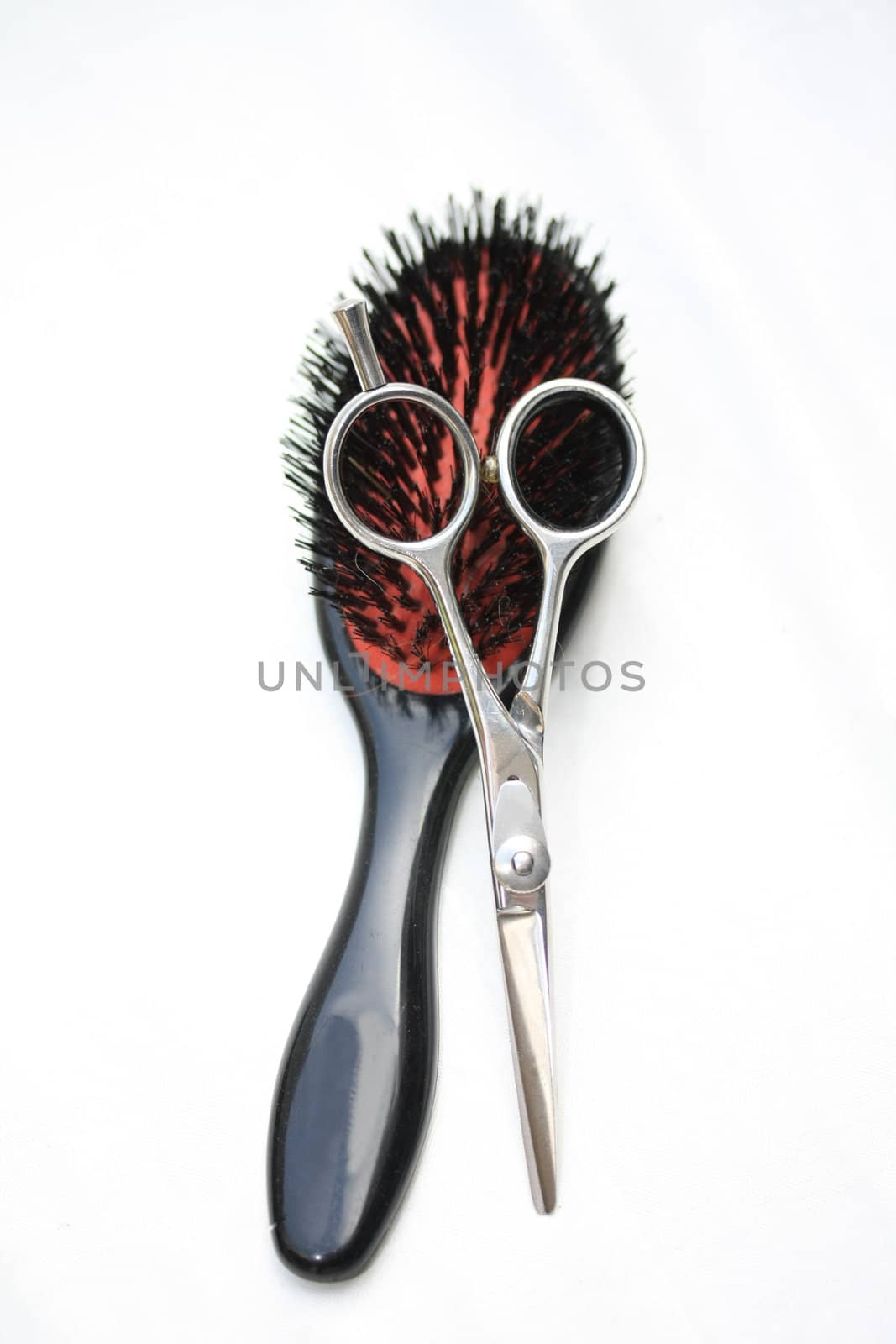 Basic Hairdressers tools - a brush and a stainless steel pair of scissors