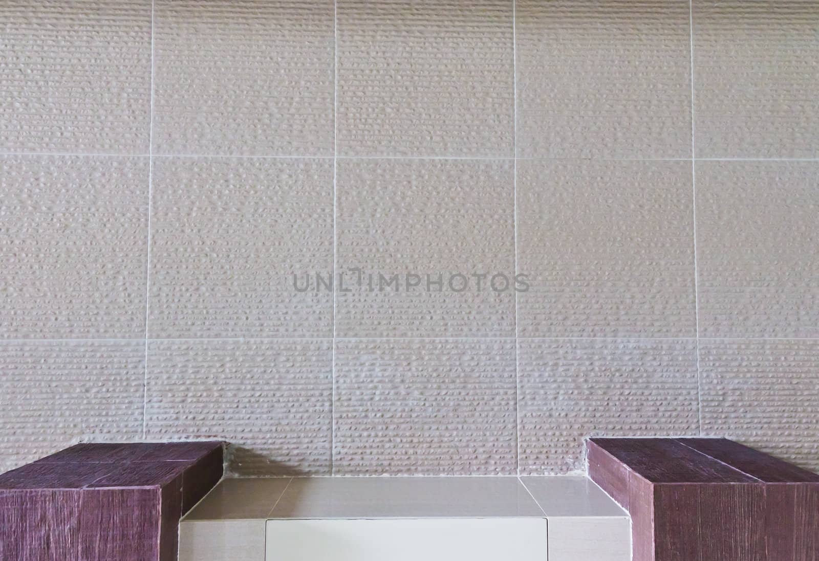 Concrete wall, a table format.Bathroom wall. And squares.