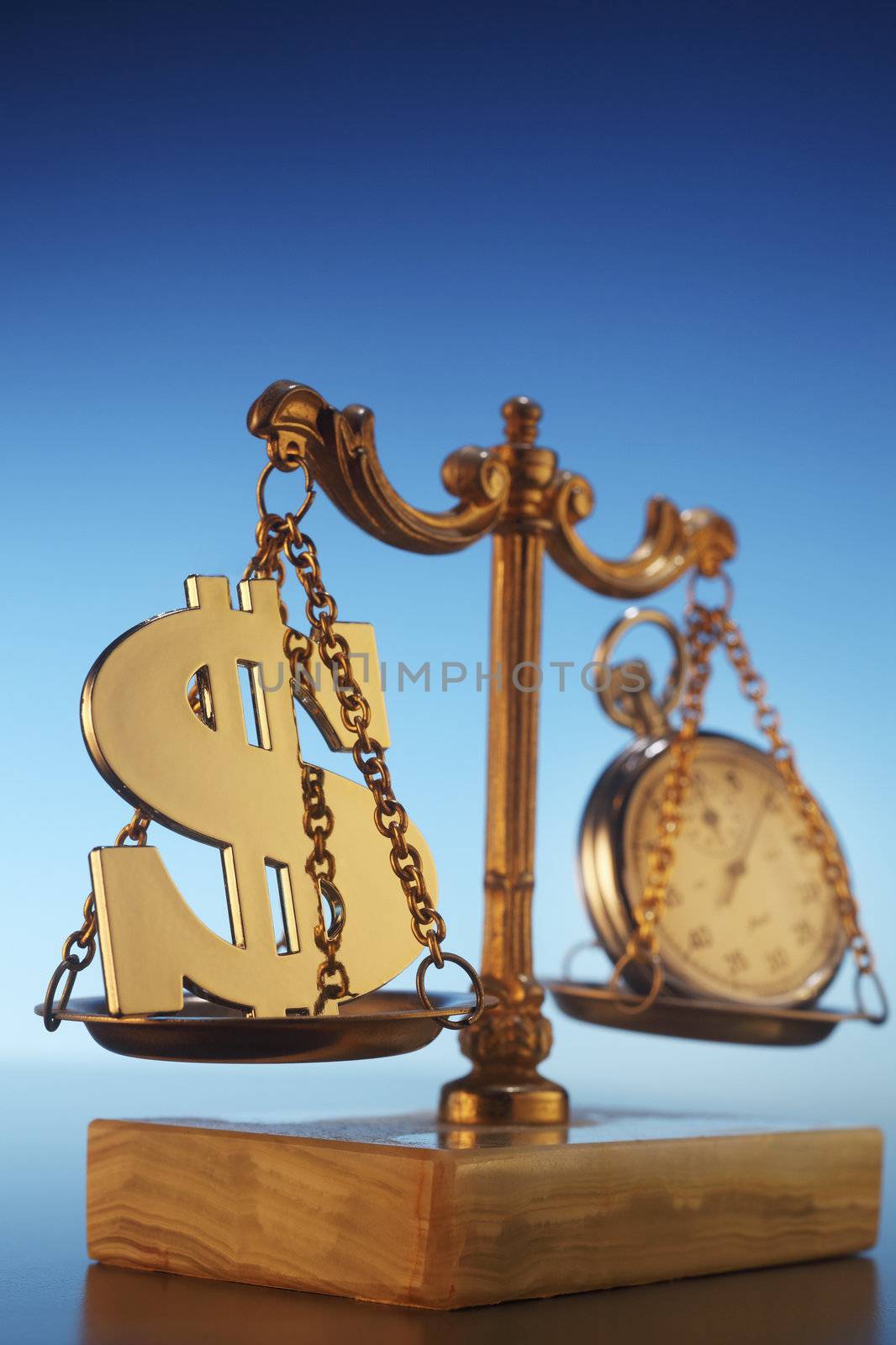 dollar sign and stop watch on the balance scale