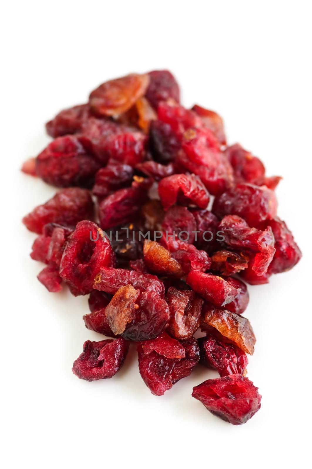 Pile of dried cranberries isolated on white background