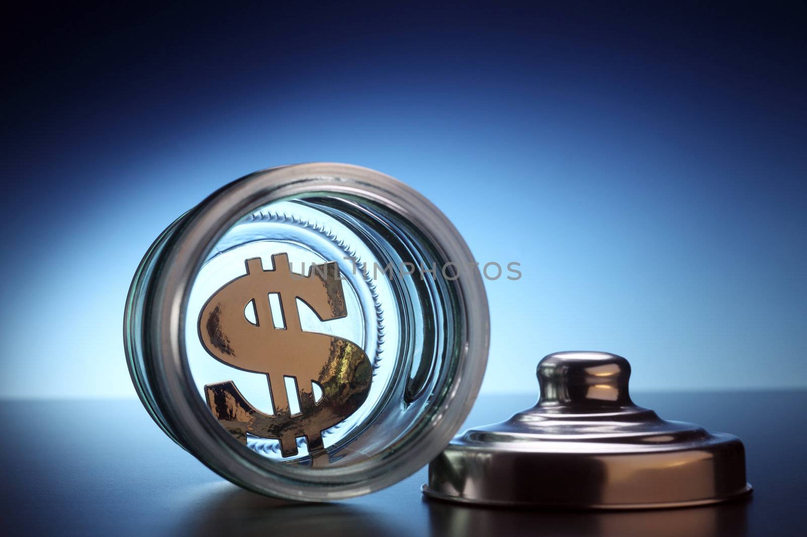 stock image if the dollar at the bottom of a jar