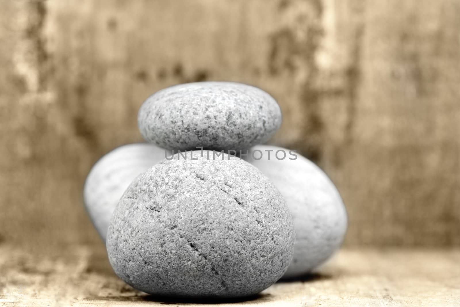 a lot of pebbles on wood background