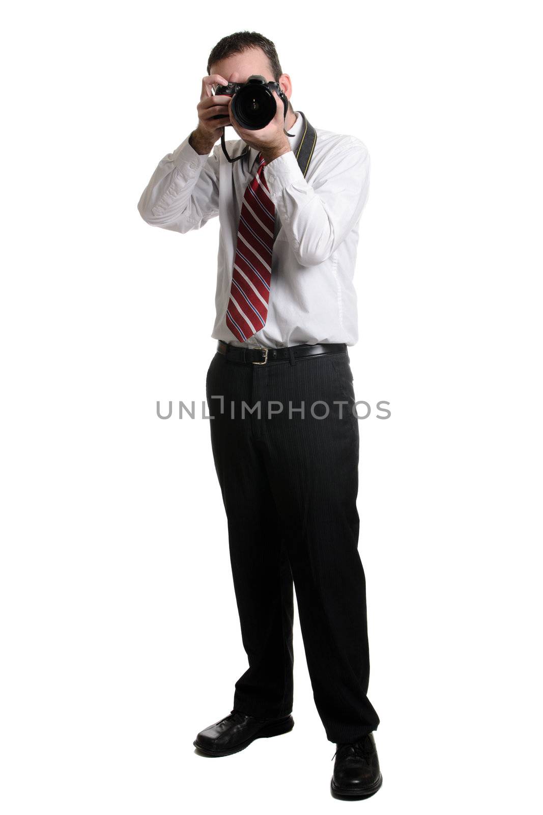 A full length view of a photographer using a DSLR, isolated against a white background.