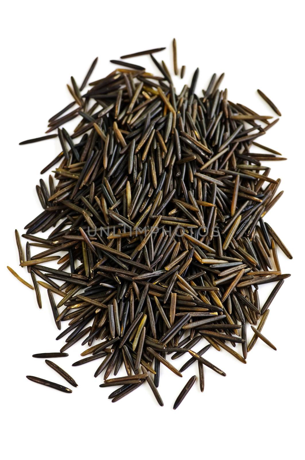 Pile of black wild long grain rice isolated on white background