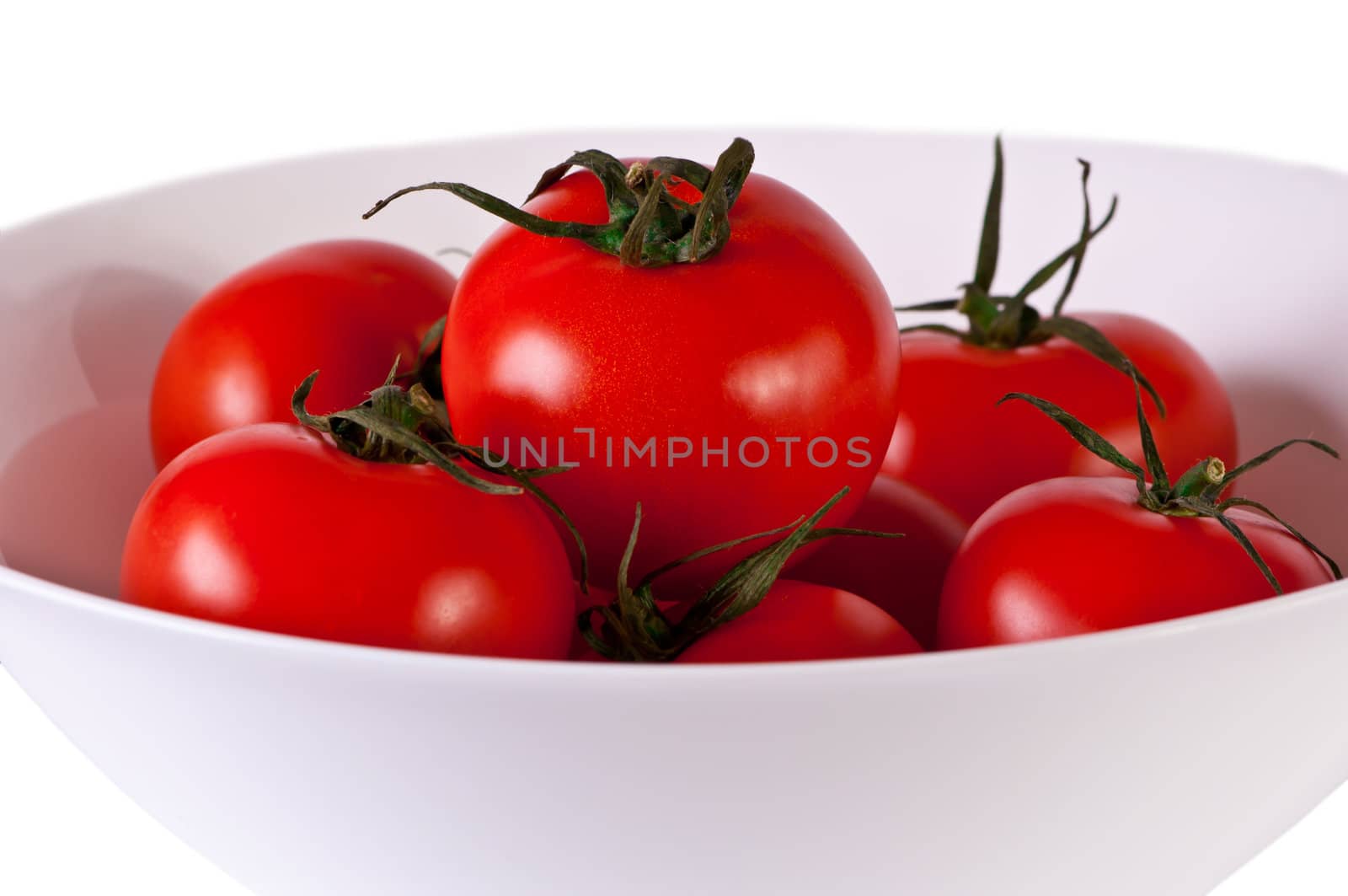 Red tomato isolated on white. Fresh red tomato. Sweet  vegetable.