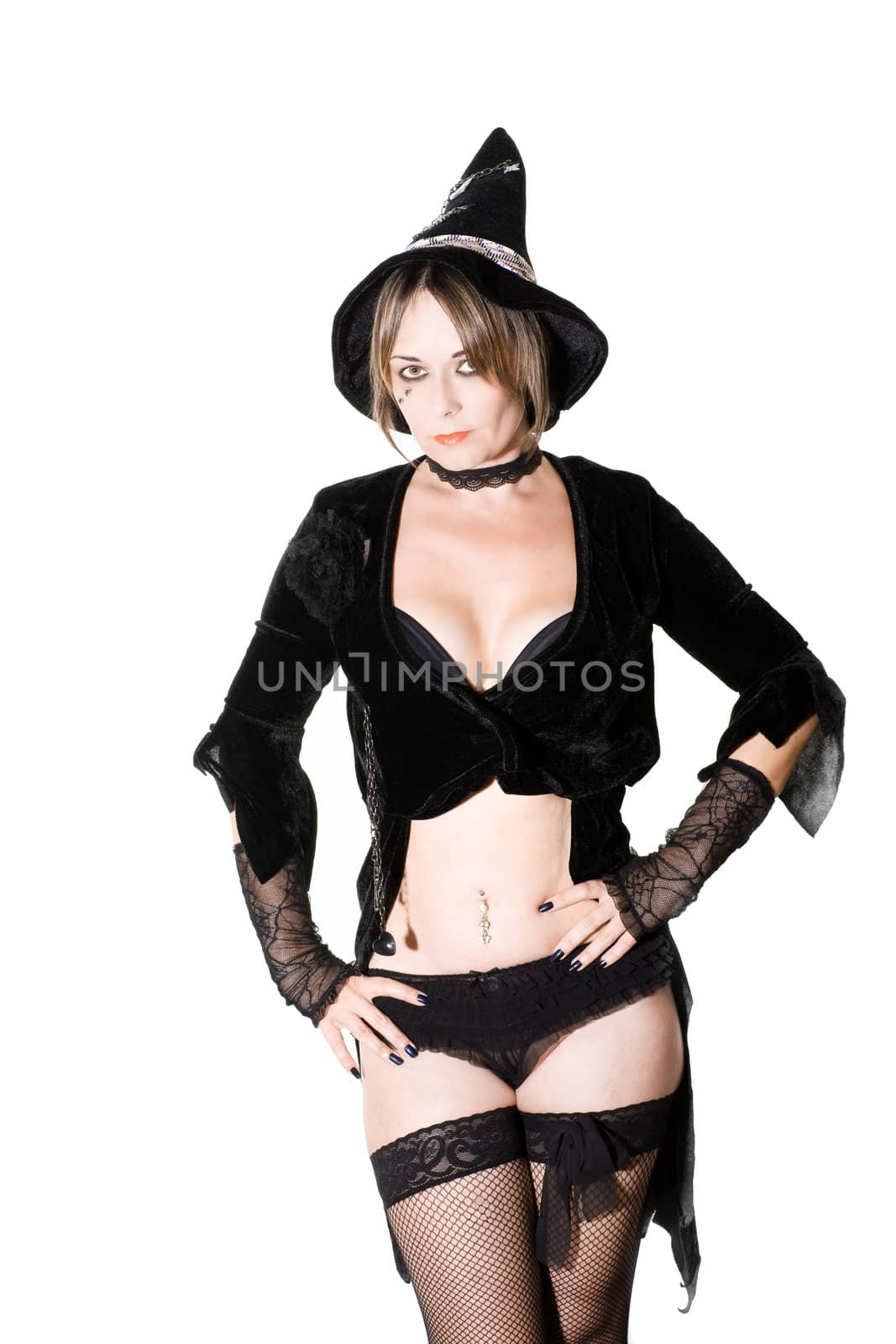 studio photo of a woman dressed as a witch isolated on white