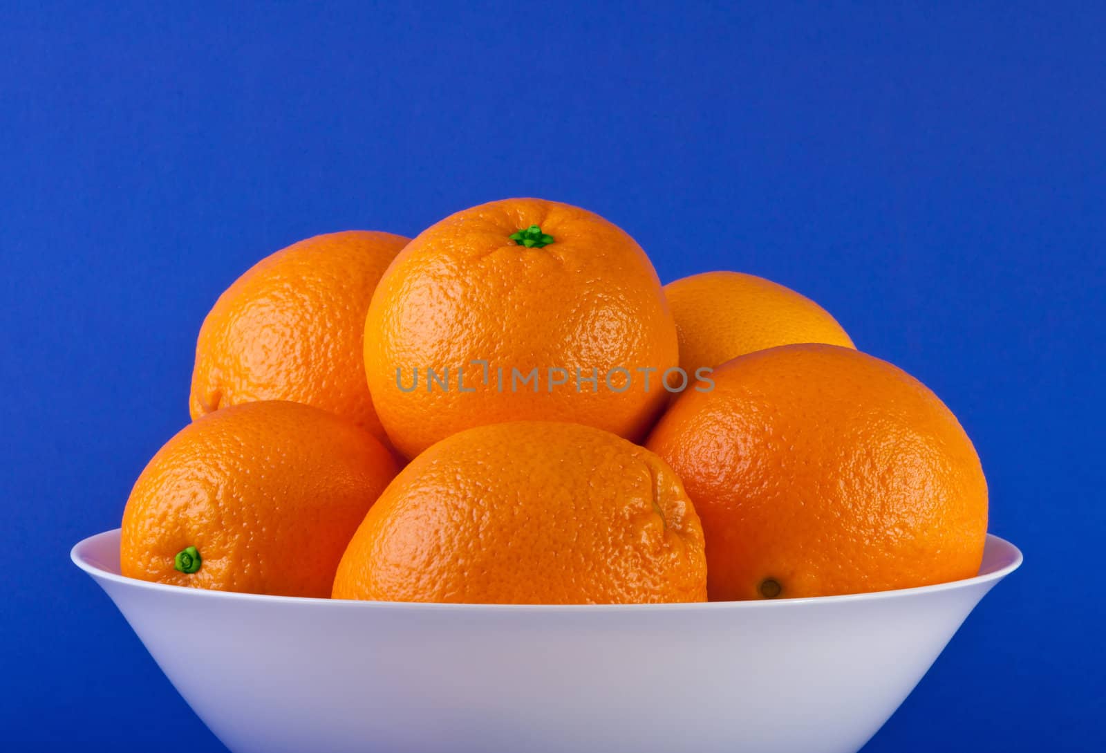 Orange isolated on a blue background. Fresh fruits Isolated orange collection.