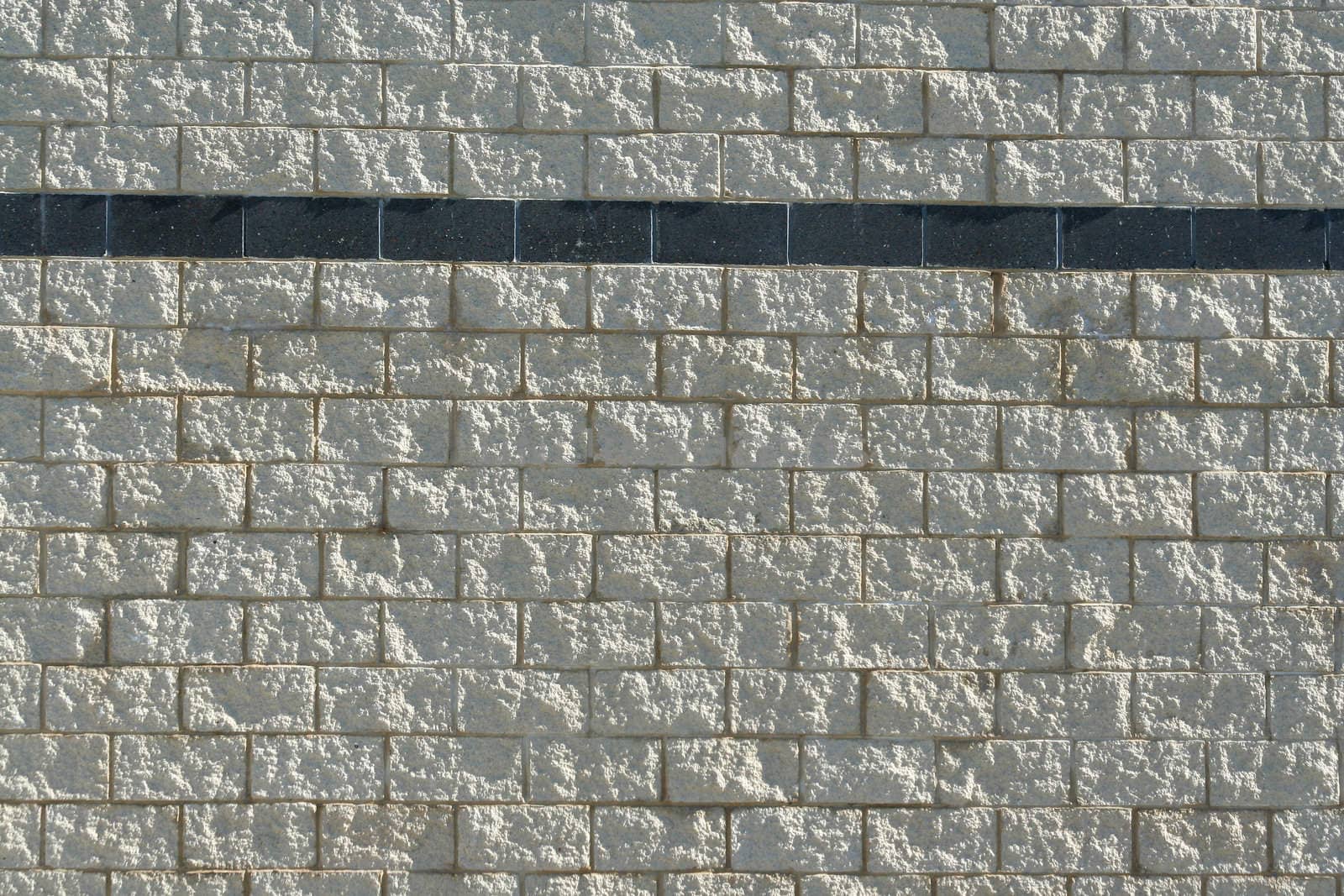 A Stone block wall with stripe background