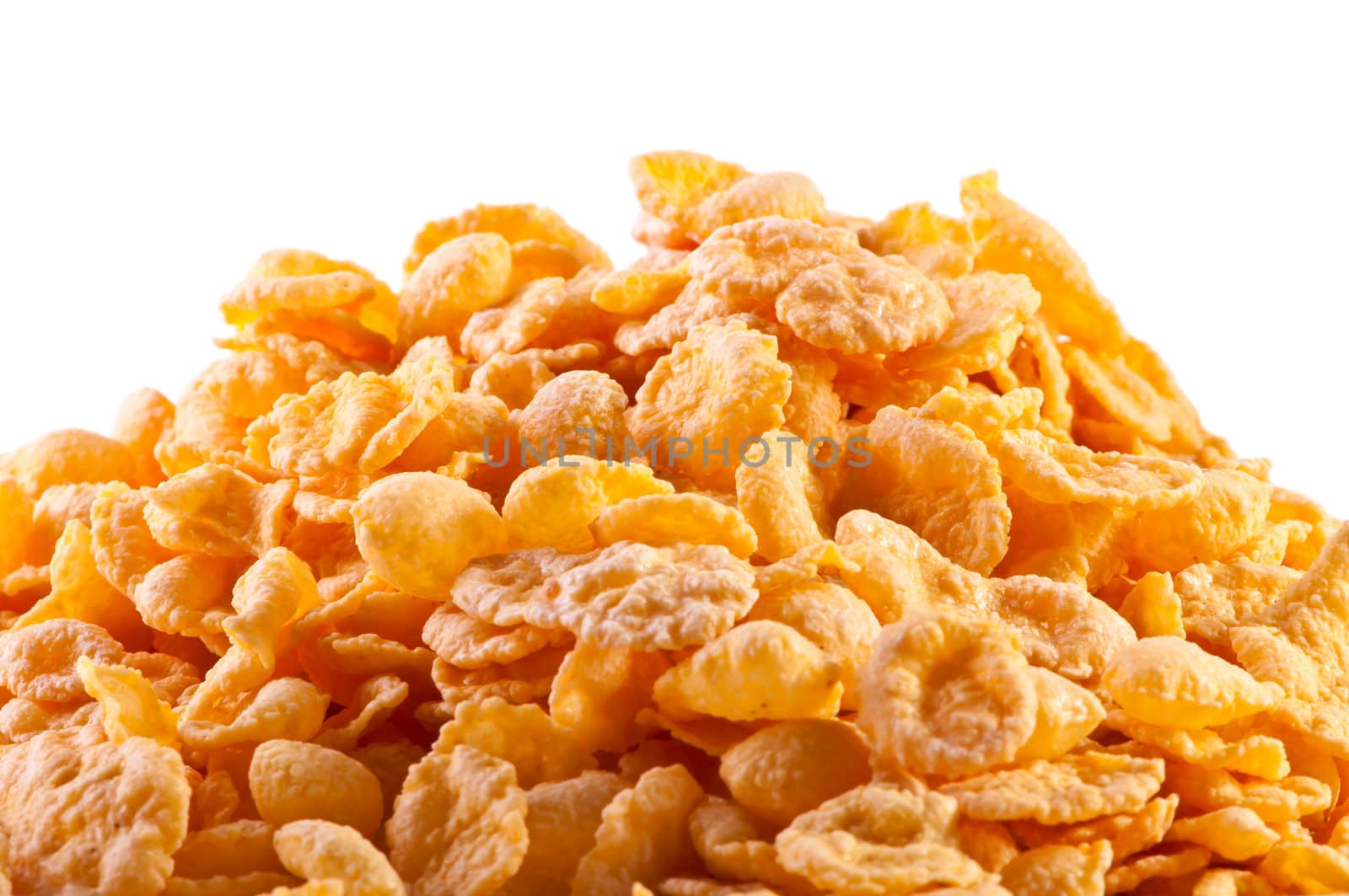 Goldish corn flakes. Macro with extremely shallow dof. Close-up of cornflakes.