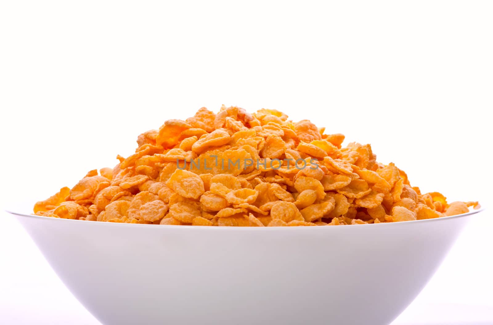 Goldish corn flakes. Macro with extremely shallow dof. Close-up of cornflakes.