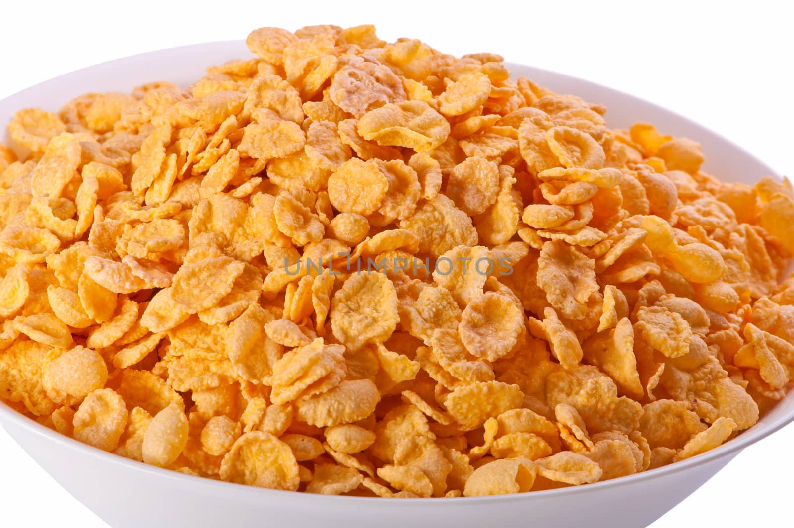 Goldish corn flakes. Macro with extremely shallow dof. Close-up of cornflakes.