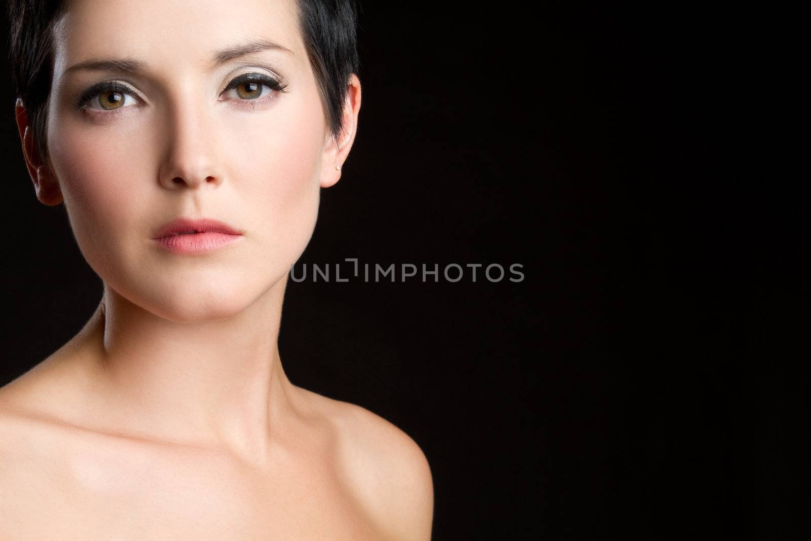 Beautiful young woman on black