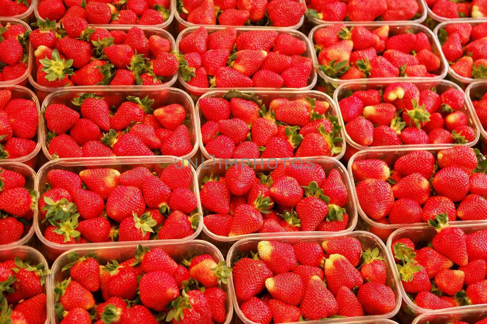 strawberries in baskets on a fresh market