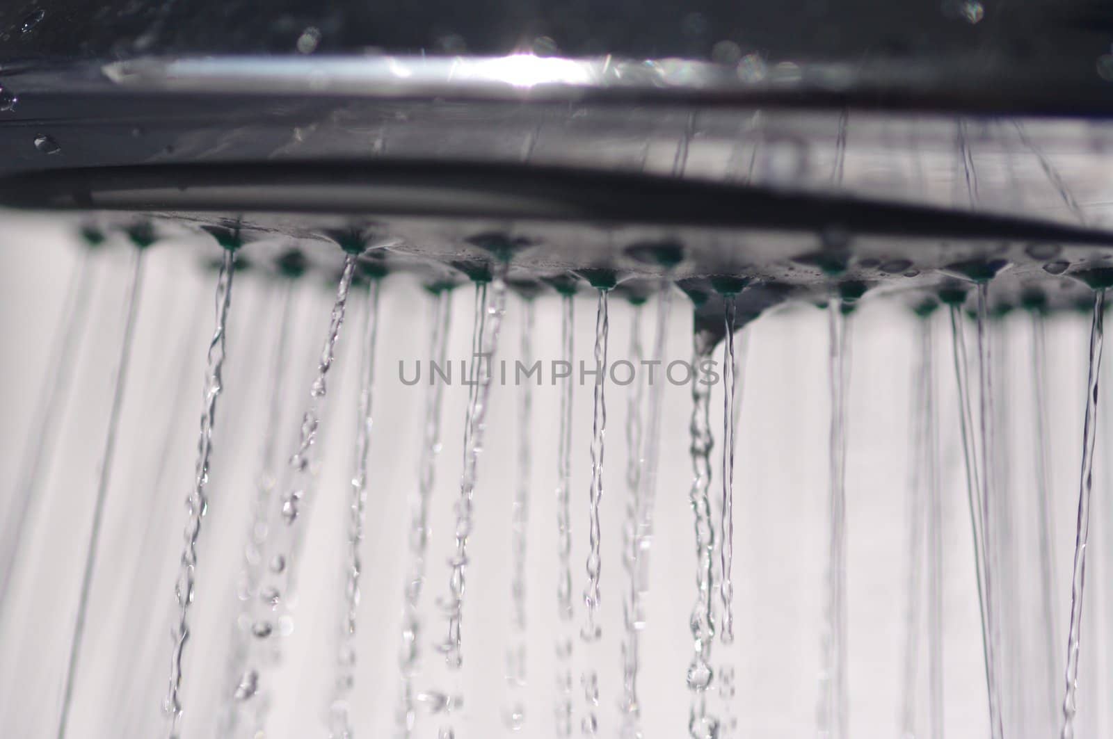 water drops falling from a shower indoors