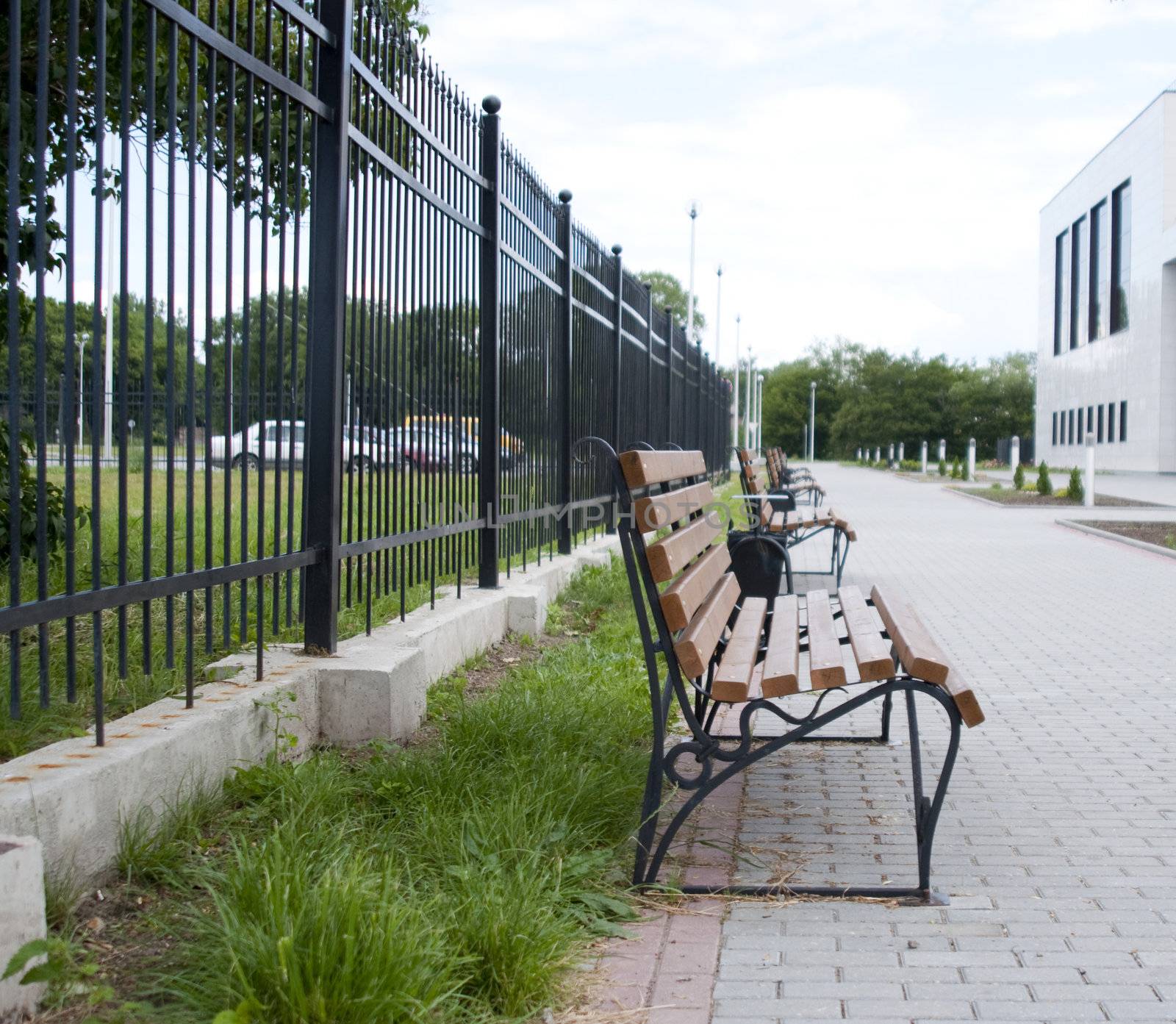 High resolution image. Bench in city street. City sidewalk.