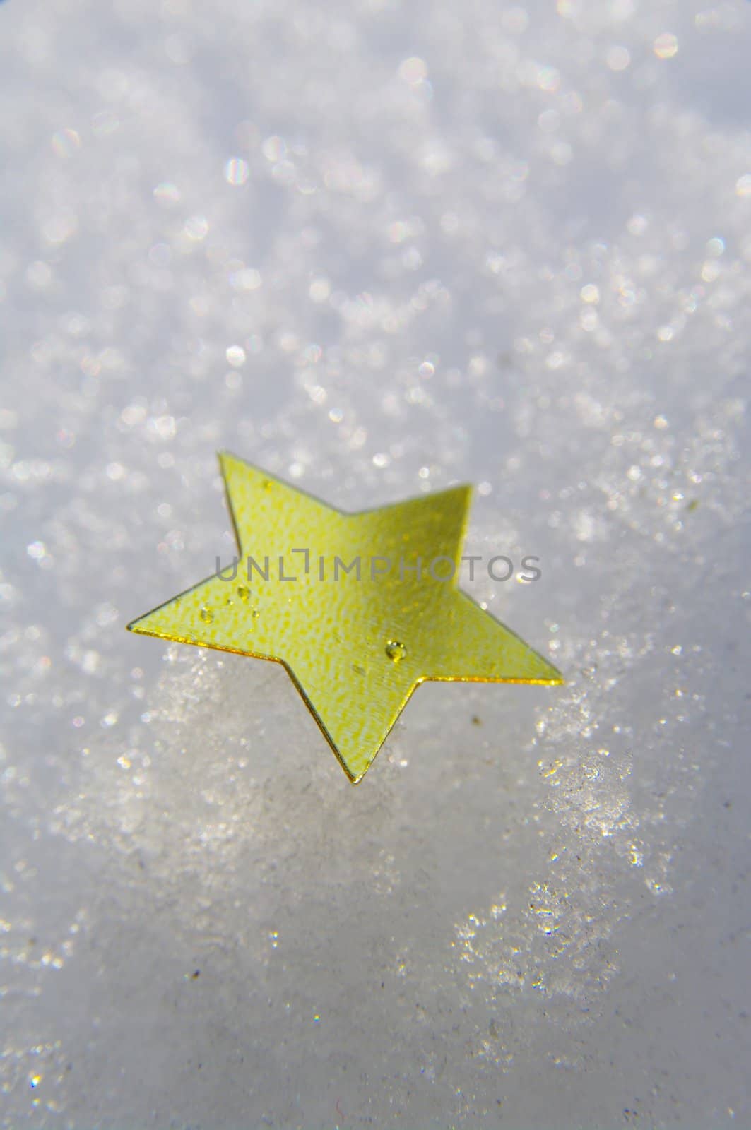 golden snow stars on a real snowy icy surface