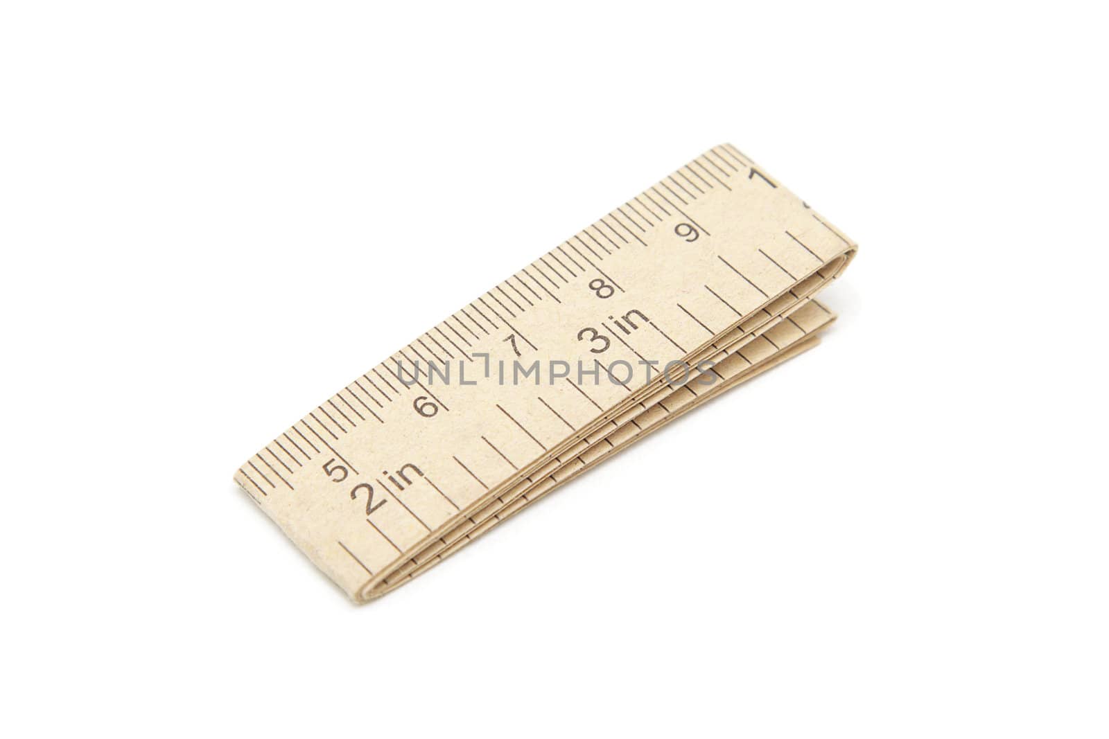 Paper measuring tape with centimeter and inch markings isolated on white