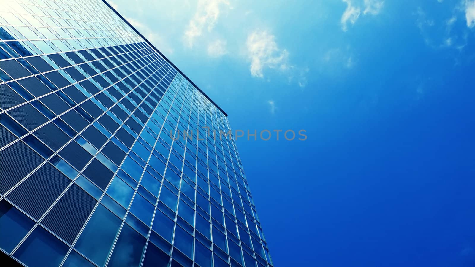 modern office skyscraper building with blue sky background