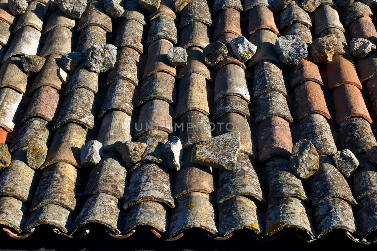 Detail of old roof tiles on Italian building