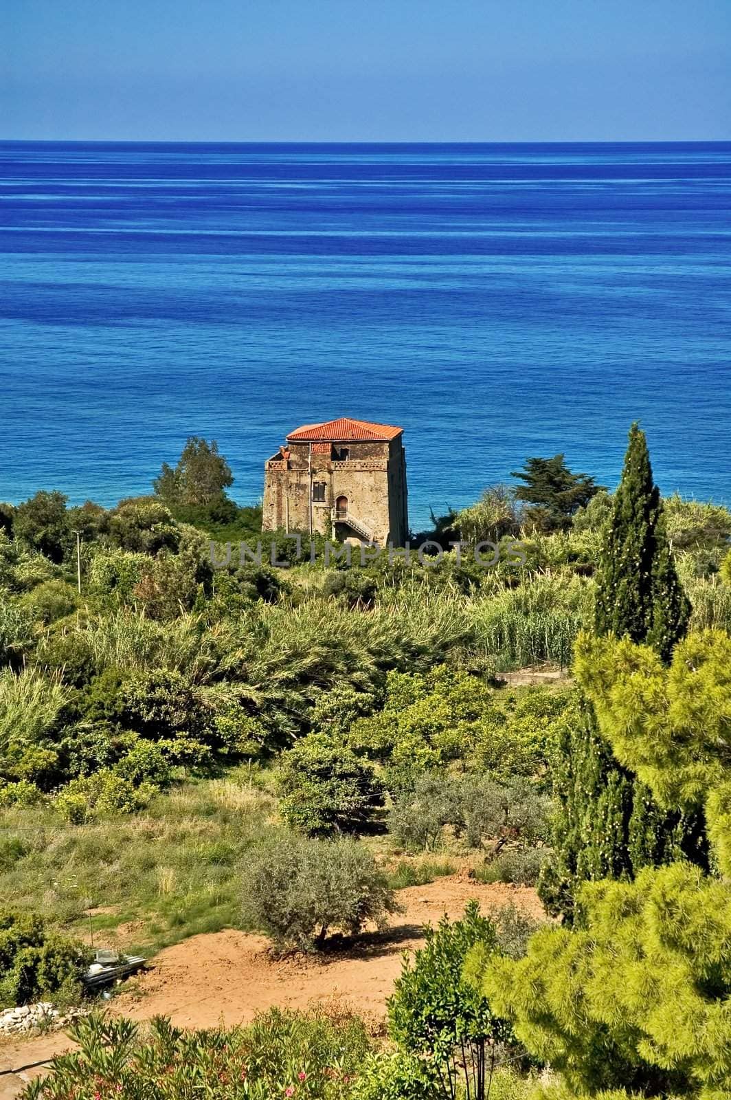 Old house in Italian garden overlooking Mediterranean sea