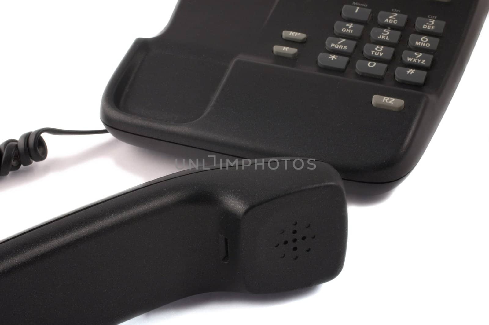Black telephone with receiver in foreground isolated on white