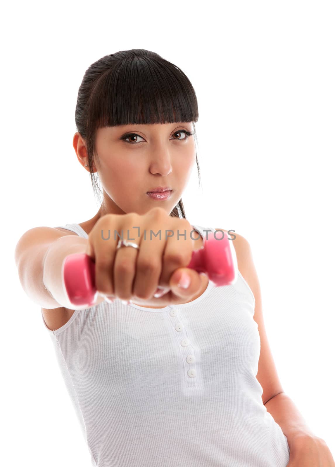 Young woman using hand weights by lovleah