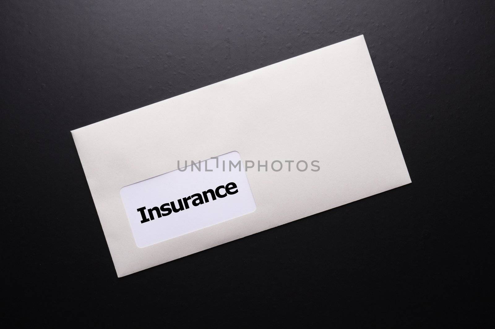 insurance concept with envelope showing risk concept