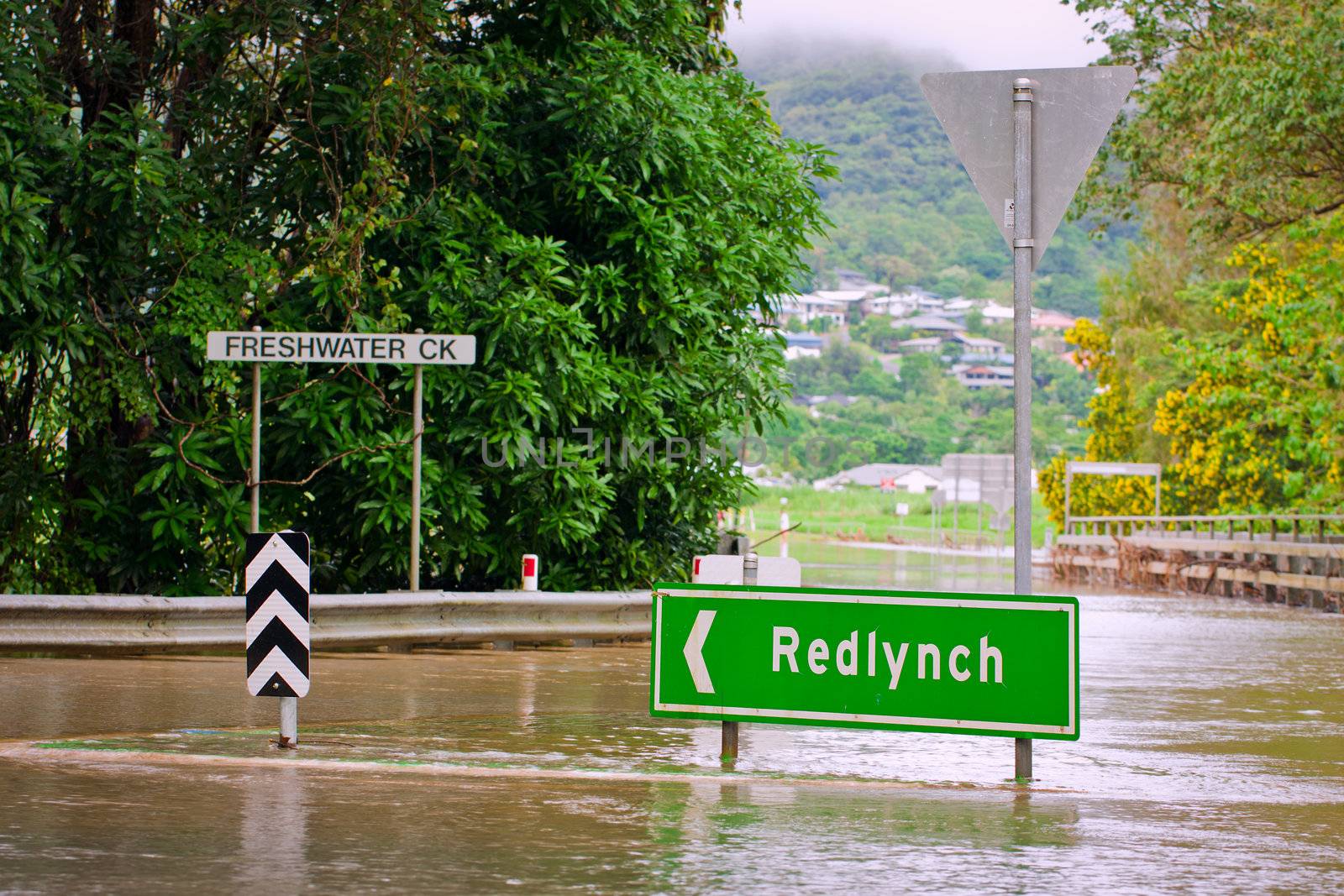 Flooded roundabout and bridge in Queensland, Australia by Jaykayl