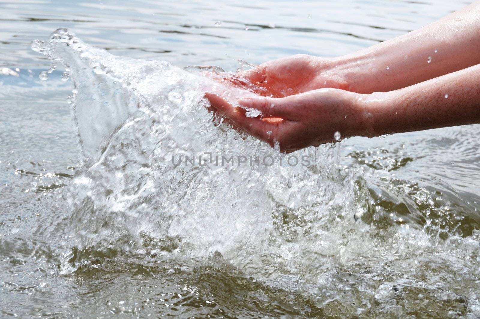 hand and splashing cold drink water showing nature concept