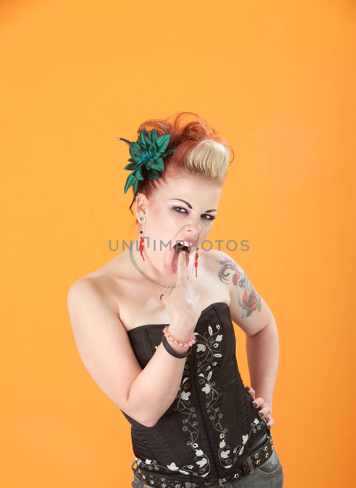Beautiful retro woman with finger stuck in her mouth